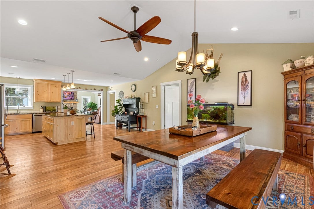 3820 Upshaw Road, Decker's Pond, Aylett, VA 23009 Vaulted ceilings with recessed lighting, wood-finish flooring, a multi-arm chandelier, ceiling fan, and cabinetry with stone countertops