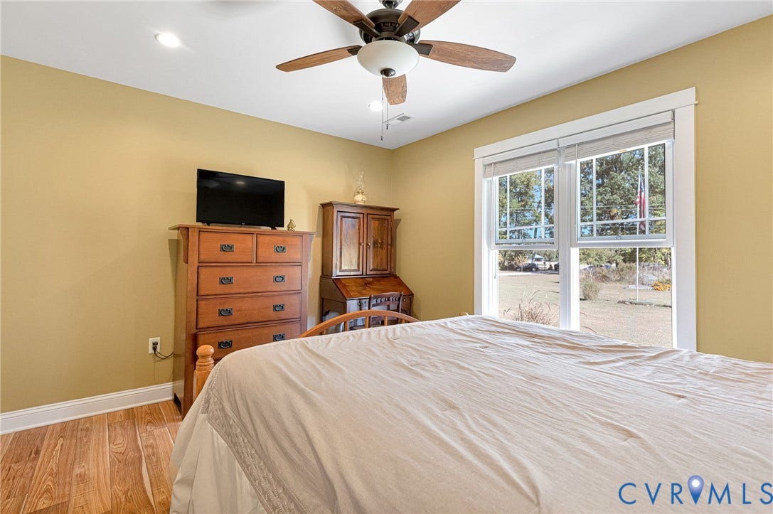 3820 Upshaw Road, Decker's Pond, Aylett, VA 23009 Wood-finish flooring, recessed lighting, ceiling fan with light kit, and multi-pane windows with trim casing