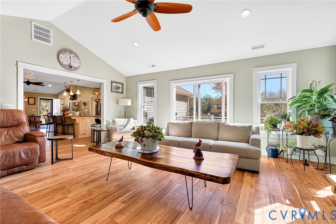 3820 Upshaw Road, Decker's Pond, Aylett, VA 23009 Living area featuring vaulted ceilings, wood-finish flooring, recessed lighting, a ceiling fan, and sliding glass doors