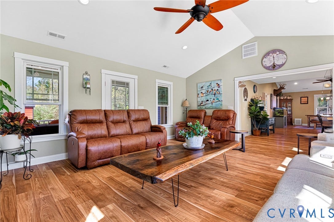 3820 Upshaw Road, Decker's Pond, Aylett, VA 23009 Vaulted ceilings, wood-finish flooring, multi-pane windows, and a ceiling fan with integrated lighting