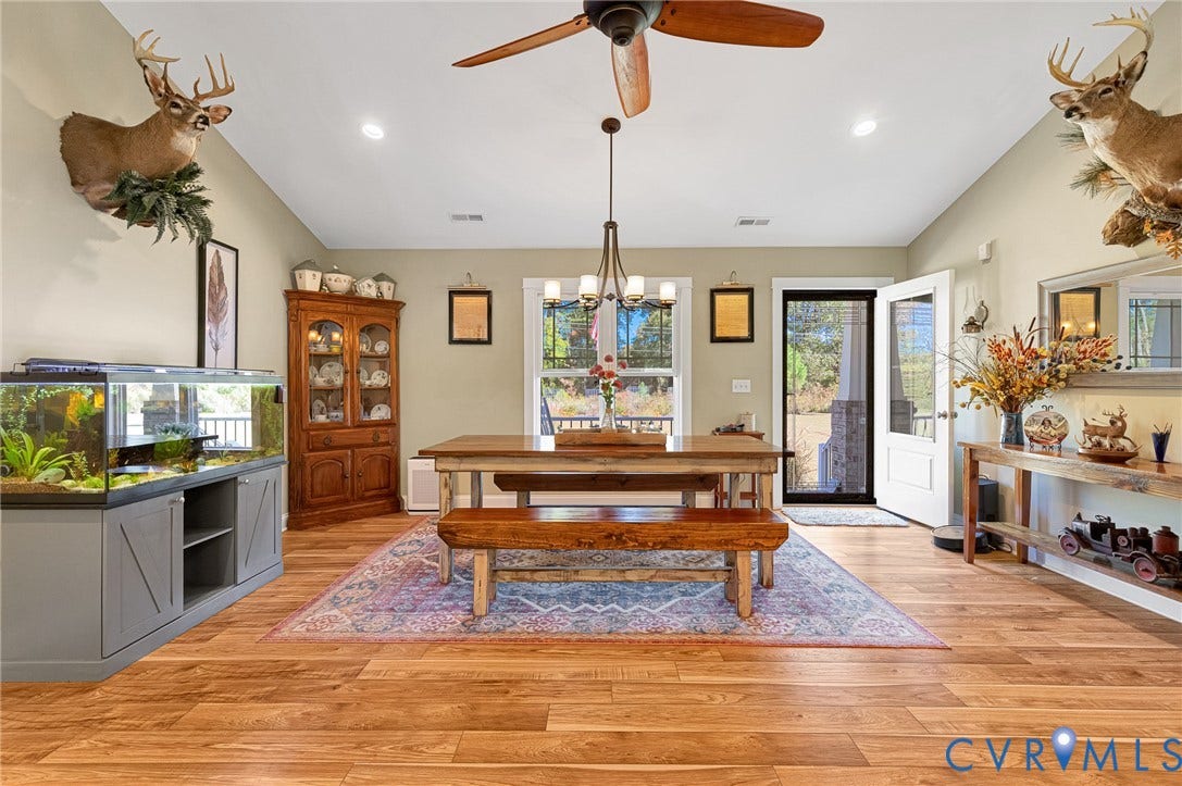 3820 Upshaw Road, Decker's Pond, Aylett, VA 23009 Vaulted ceiling room featuring wood-finish flooring, a central multi-light chandelier, a ceiling fan, and recessed lighting