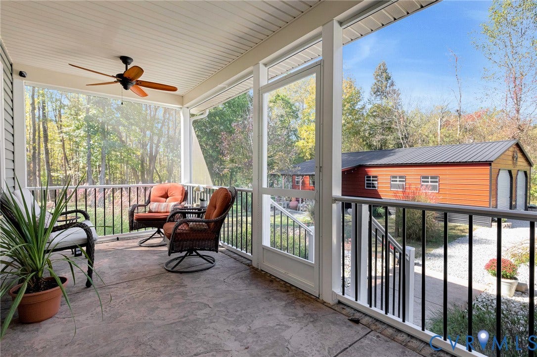 3820 Upshaw Road, Decker's Pond, Aylett, VA 23009 Screened porch featuring concrete flooring, a ceiling fan, and metal railings