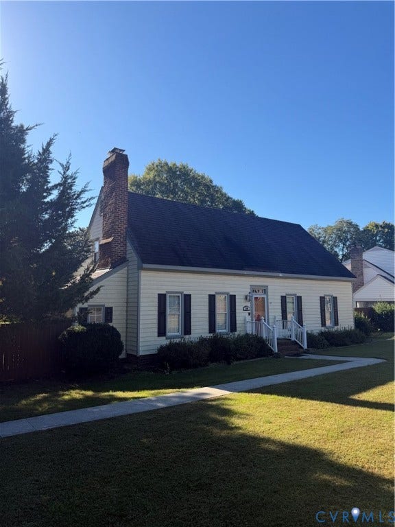 2305 Lydell Drive, Ginter Park - Adjacent, Glen Allen, VA 23228 Exterior featuring light-colored horizontal siding, dark window shutters, an asphalt shingle roof, and an exposed masonry chimney