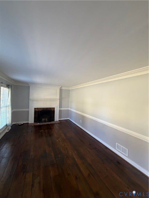 2305 Lydell Drive, Ginter Park - Adjacent, Glen Allen, VA 23228 Fireplace with a white wood mantel, crown molding, chair rail trim, and dark-toned wood-finish flooring