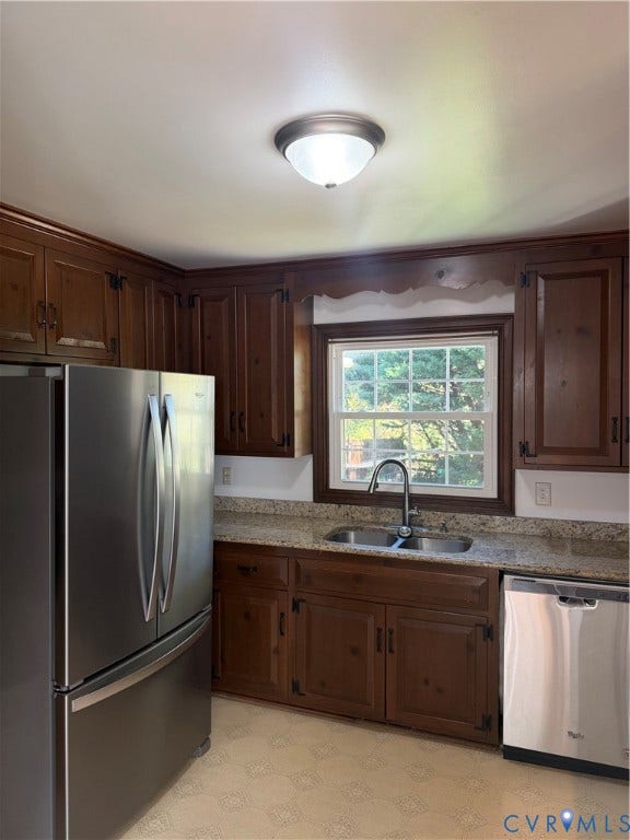 2305 Lydell Drive, Ginter Park - Adjacent, Glen Allen, VA 23228 Kitchen featuring stained wood cabinetry, stone-finish countertops, stainless steel appliances, double-basin sink with a pull-down faucet, and a window above the workspace
