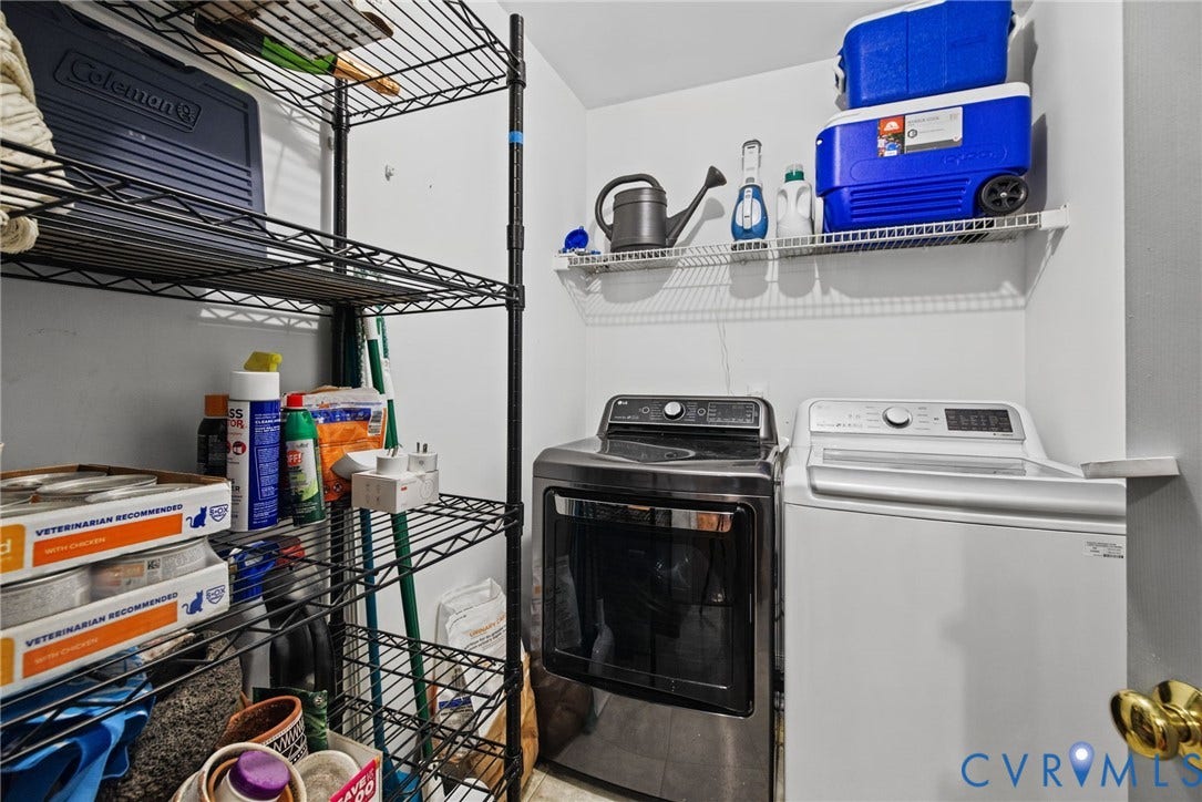 Utility area featuring wire shelving and dedicated laundry hookups