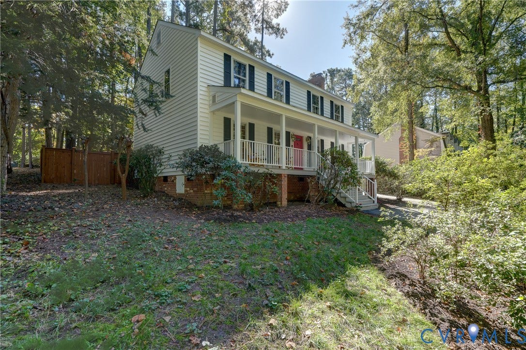5 Bridgehampton Place, Yorkshire, Henrico, VA 23229 Two-story colonial-style residence featuring horizontal siding, a full-length covered front porch with white railing, and a brick foundation base