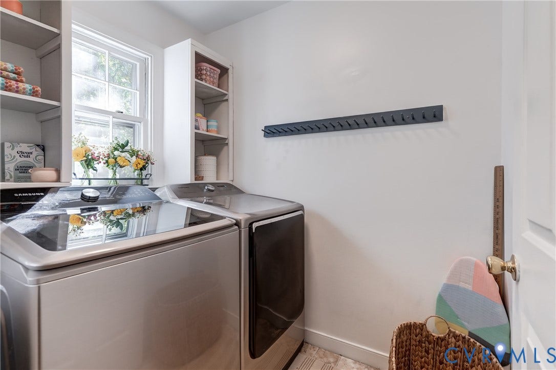 5 Bridgehampton Place, Yorkshire, Henrico, VA 23229 Laundry area featuring custom white built-in shelving, a single-hung window, and a wall-mounted hook rail