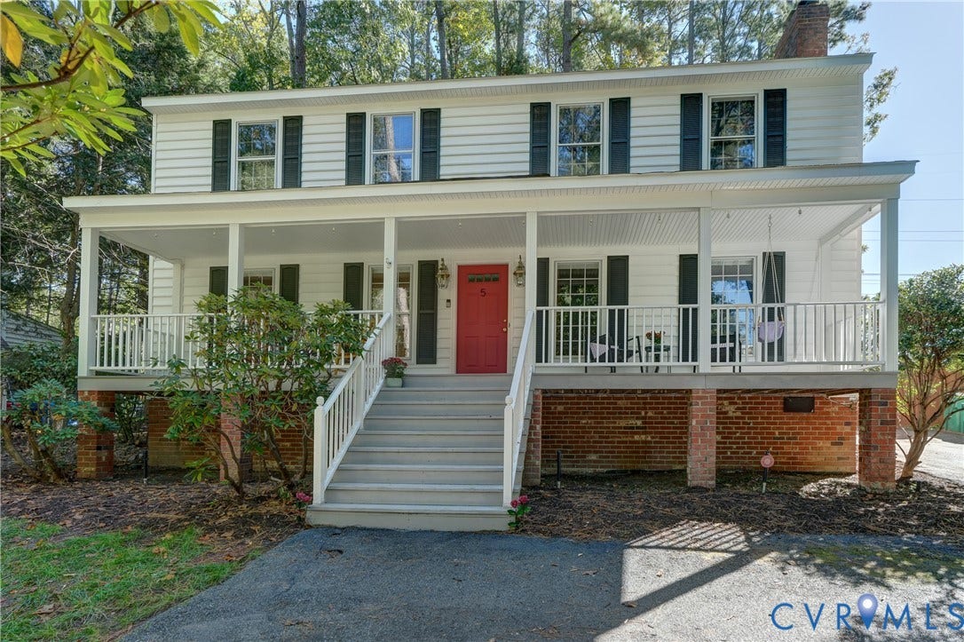 5 Bridgehampton Place, Yorkshire, Henrico, VA 23229 Two-story Colonial exterior featuring white horizontal siding, black shutters, a red front door, and a full-width covered front porch with white railing