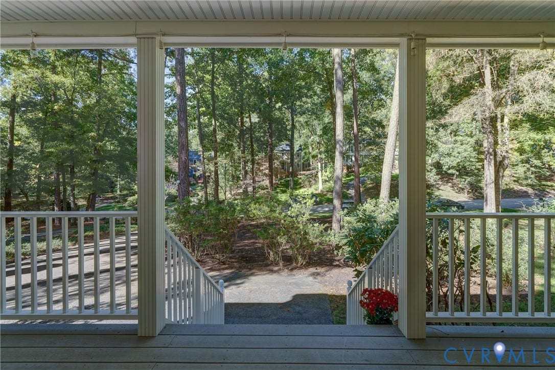5 Bridgehampton Place, Yorkshire, Henrico, VA 23229 Covered porch featuring painted white balusters, wood-plank flooring, and structural columns