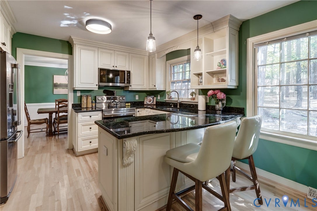 5 Bridgehampton Place, Yorkshire, Henrico, VA 23229 Kitchen featuring off-white cabinetry, dark stone countertops, wood-finish flooring, multi-pane windows, and pendant lighting