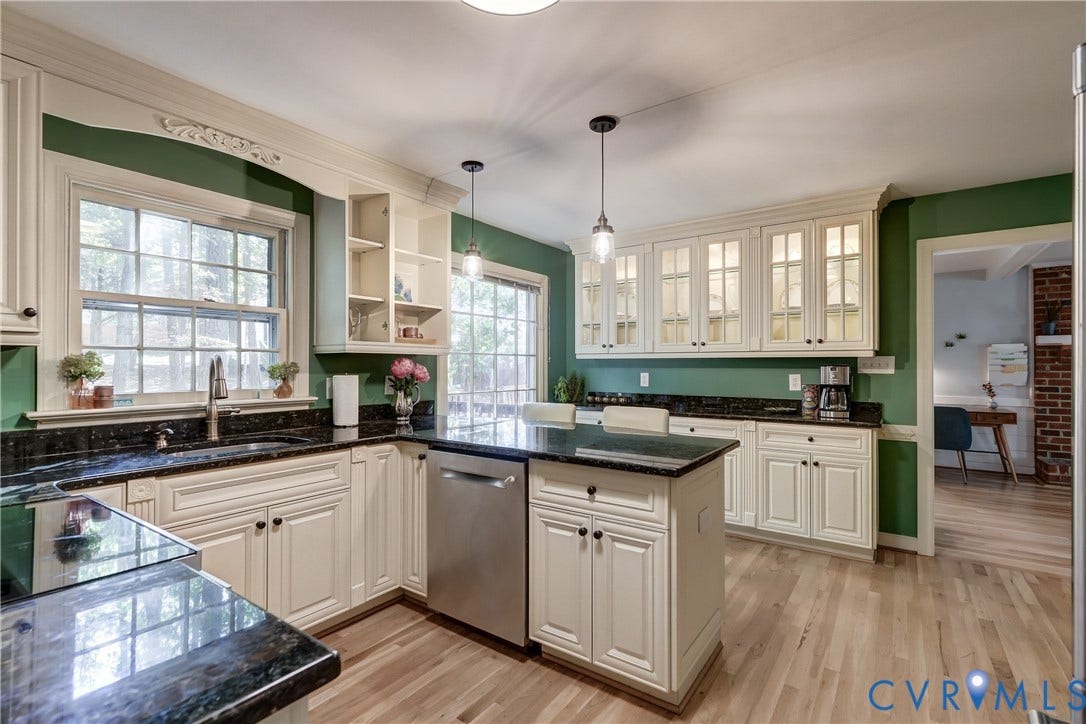 5 Bridgehampton Place, Yorkshire, Henrico, VA 23229 Kitchen featuring cream-colored shaker cabinetry with glass-front uppers, stone-surfaced countertops, a center island with stainless steel dishwasher, dual pendant lighting, and wood-finish flooring