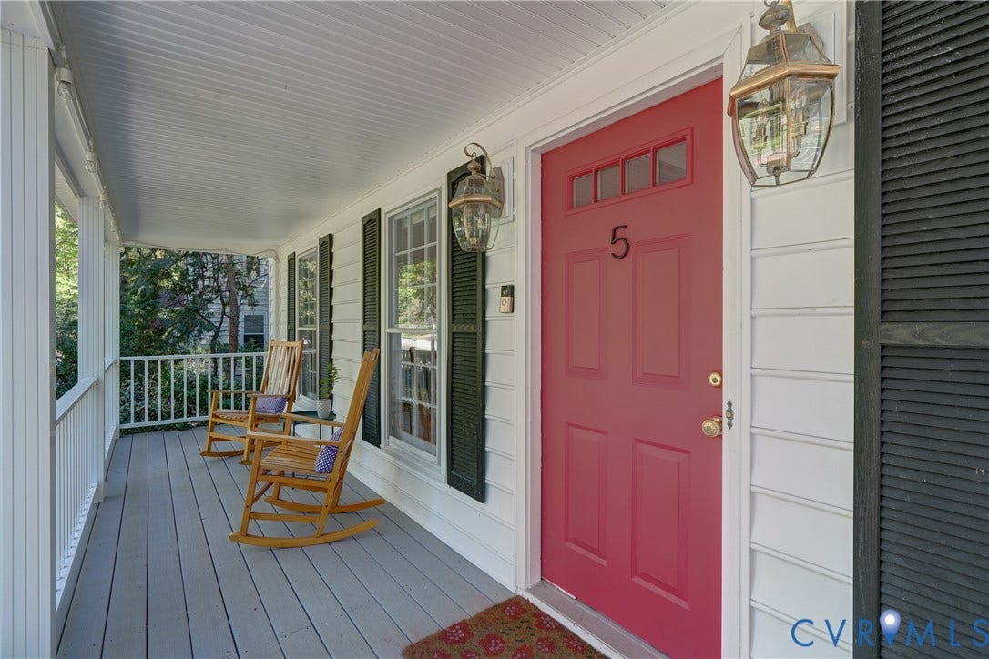 5 Bridgehampton Place, Yorkshire, Henrico, VA 23229 Covered front porch featuring white lap siding, black louvered shutters, a painted entry door with transom glass, and exterior lantern-style sconces