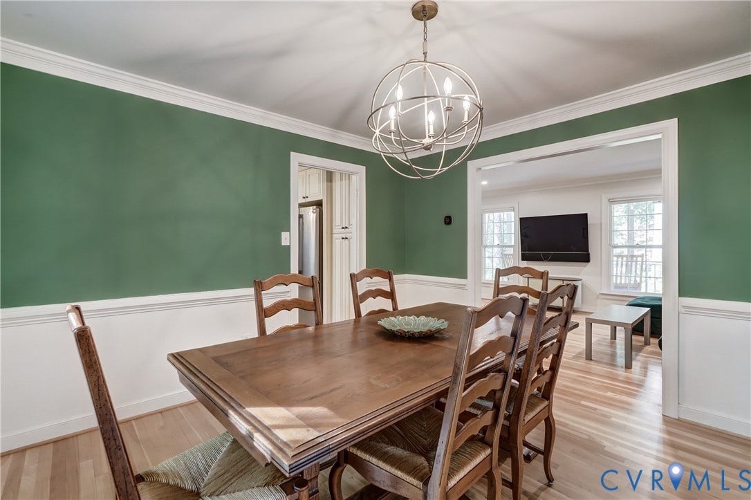 5 Bridgehampton Place, Yorkshire, Henrico, VA 23229 Dining area featuring wood-finish flooring, white crown molding, crisp chair rail trim, and a spherical metal chandelier