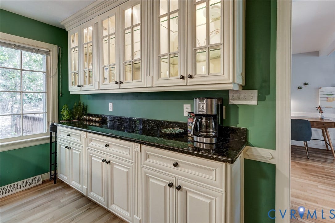 5 Bridgehampton Place, Yorkshire, Henrico, VA 23229 Custom cabinetry with glass-front upper doors, stone countertops, multi-pane window, and wood-finish flooring