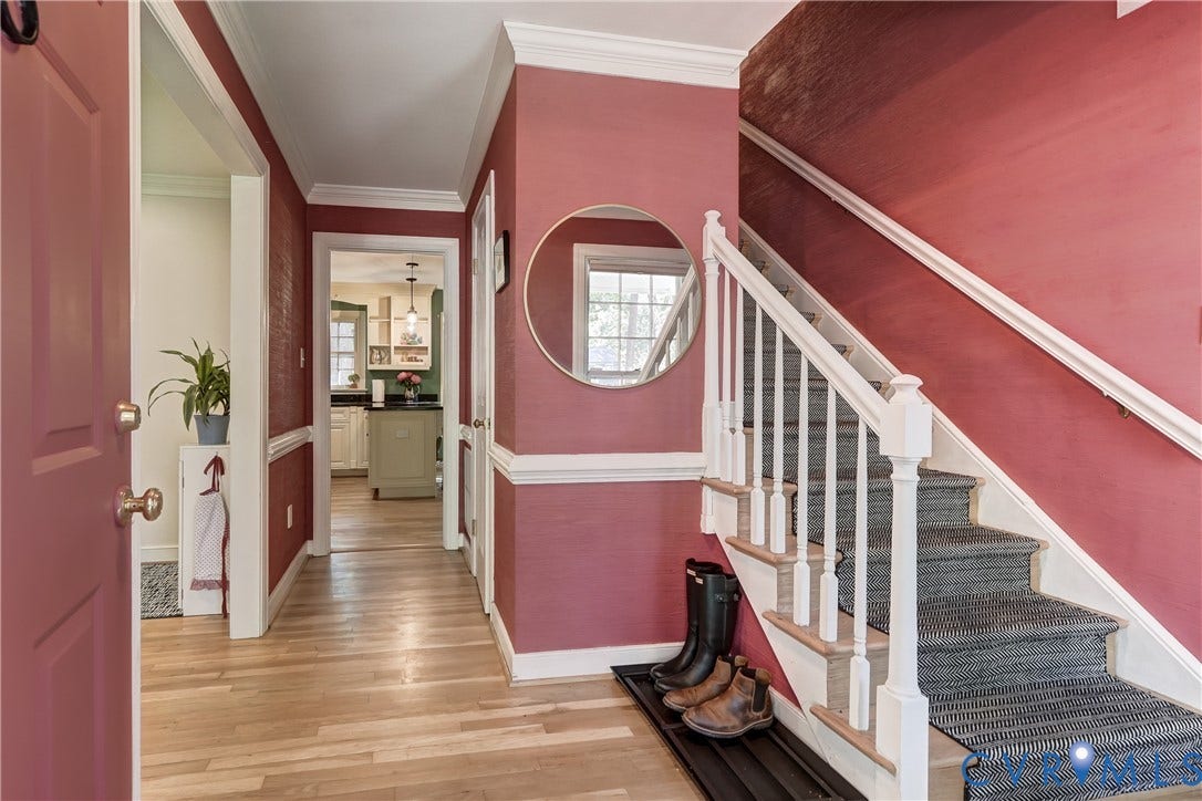 5 Bridgehampton Place, Yorkshire, Henrico, VA 23229 Foyer featuring wood-finish flooring, white crown molding, chair rail trim, and a staircase with white balusters and handrail