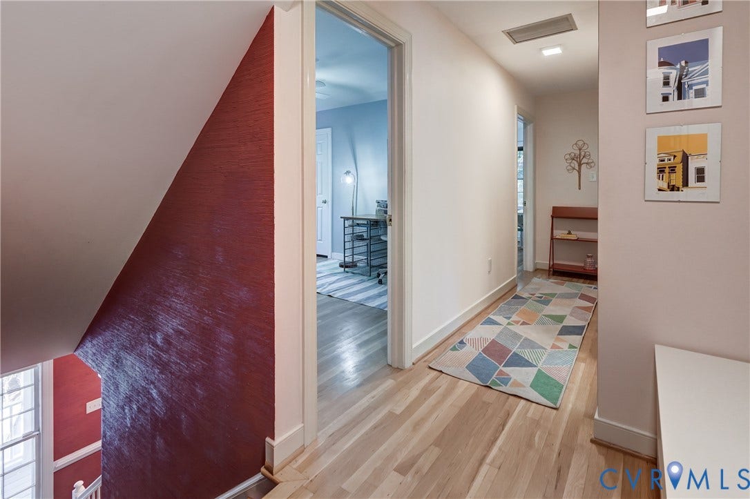 5 Bridgehampton Place, Yorkshire, Henrico, VA 23229 Hallway featuring light-toned wood-finish flooring, recessed ceiling lighting, and a prominent red-painted textured accent wall