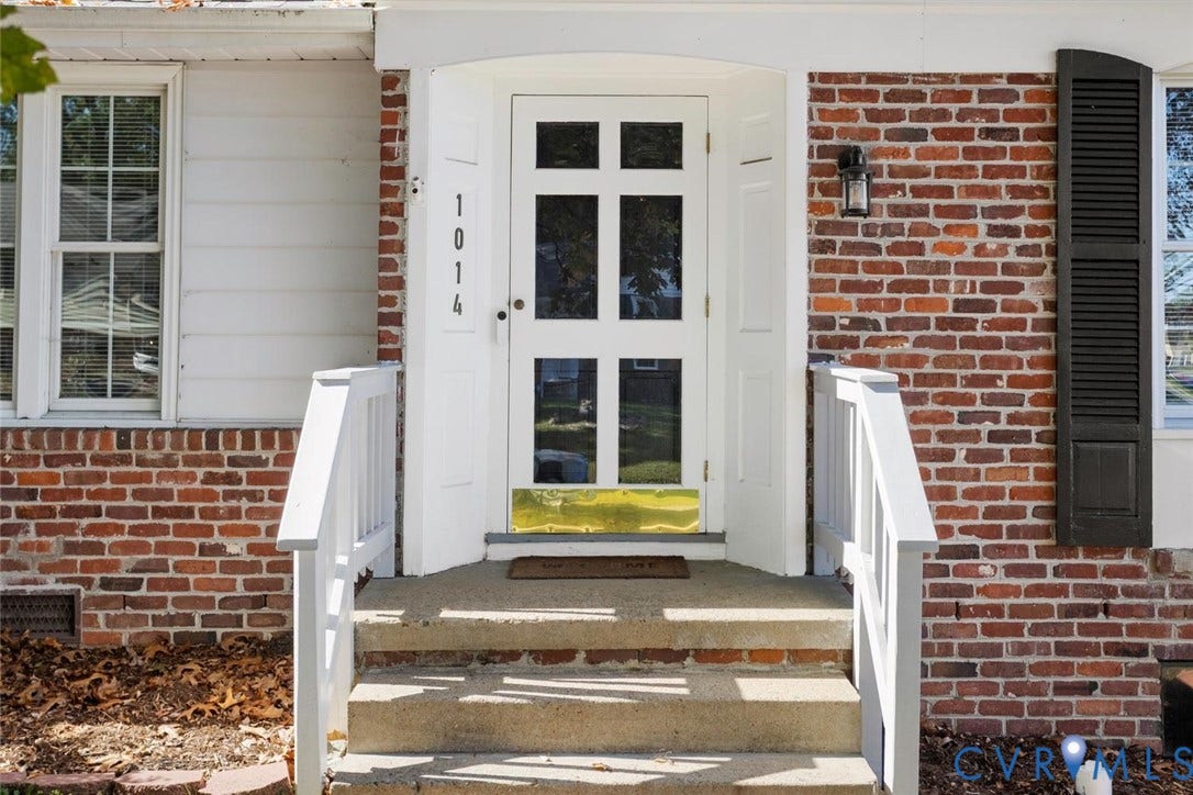 1014 Westbriar Drive, Henrico, VA 23238 Exterior entrance featuring a brick facade, white multi-pane glass entry door with a brass kick plate, shuttered windows, and concrete steps with white handrails