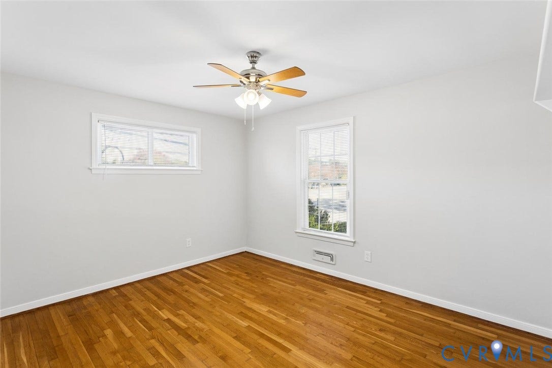 1014 Westbriar Drive, Henrico, VA 23238 Interior room featuring wood-finish flooring, a multi-blade ceiling fan with integrated lighting, and double-pane windows
