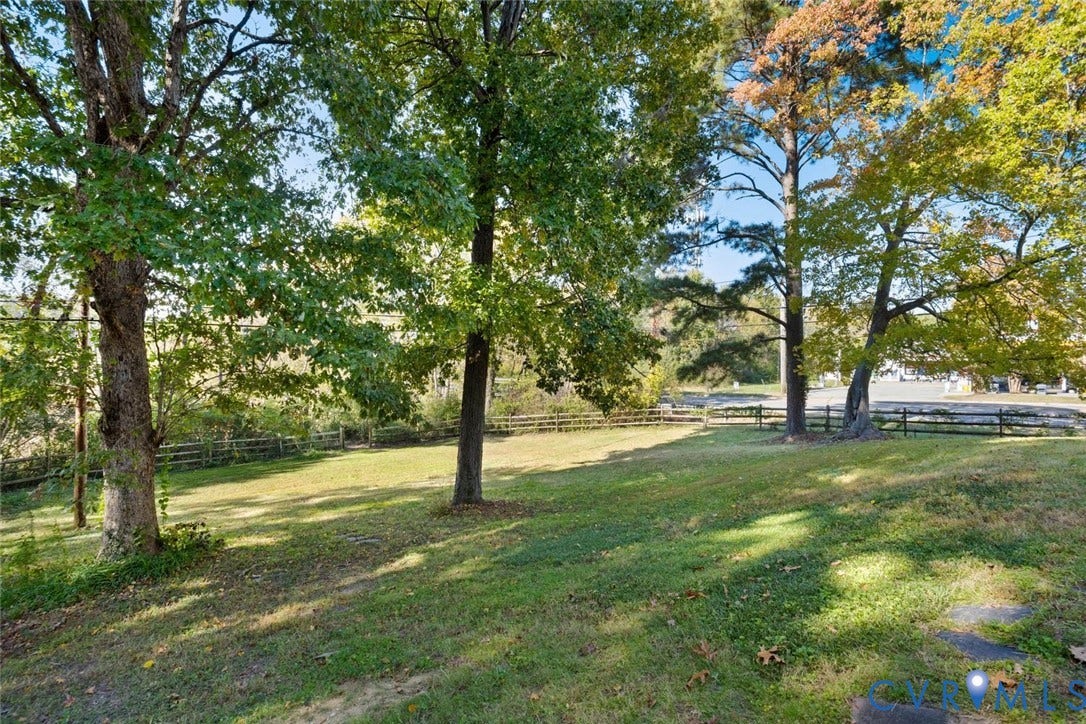 1014 Westbriar Drive, Henrico, VA 23238 Expansive grassy grounds featuring mature trees and a perimeter split-rail fence