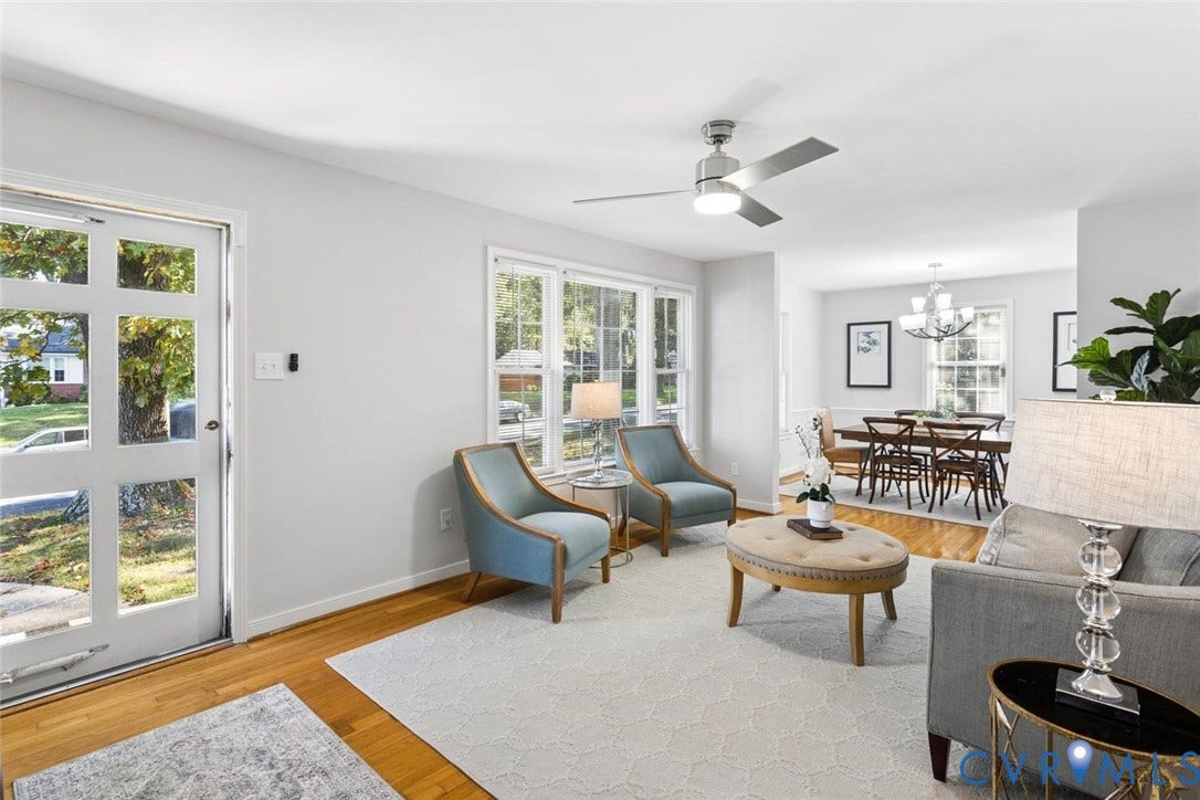 1014 Westbriar Drive, Henrico, VA 23238 Hardwood flooring, multi-pane entry door, oversized windows, and ceiling fan with integrated lighting