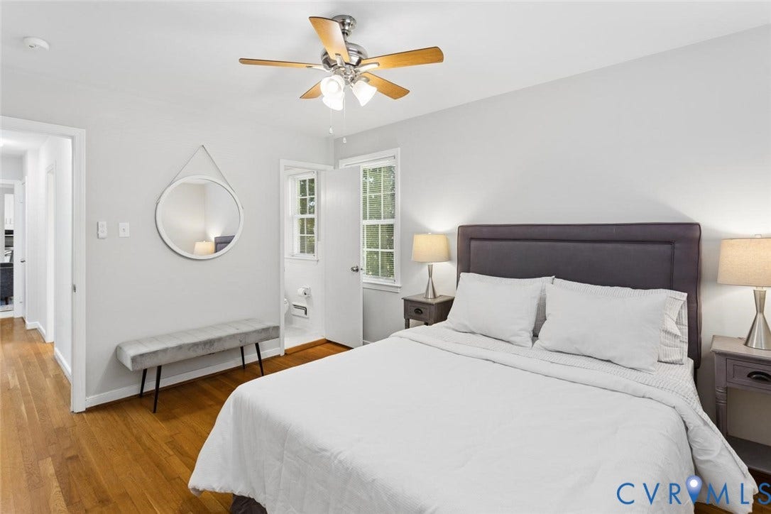 1014 Westbriar Drive, Henrico, VA 23238 Bedroom featuring wood-finish flooring, a multi-blade ceiling fan with integrated lighting, and double-hung windows