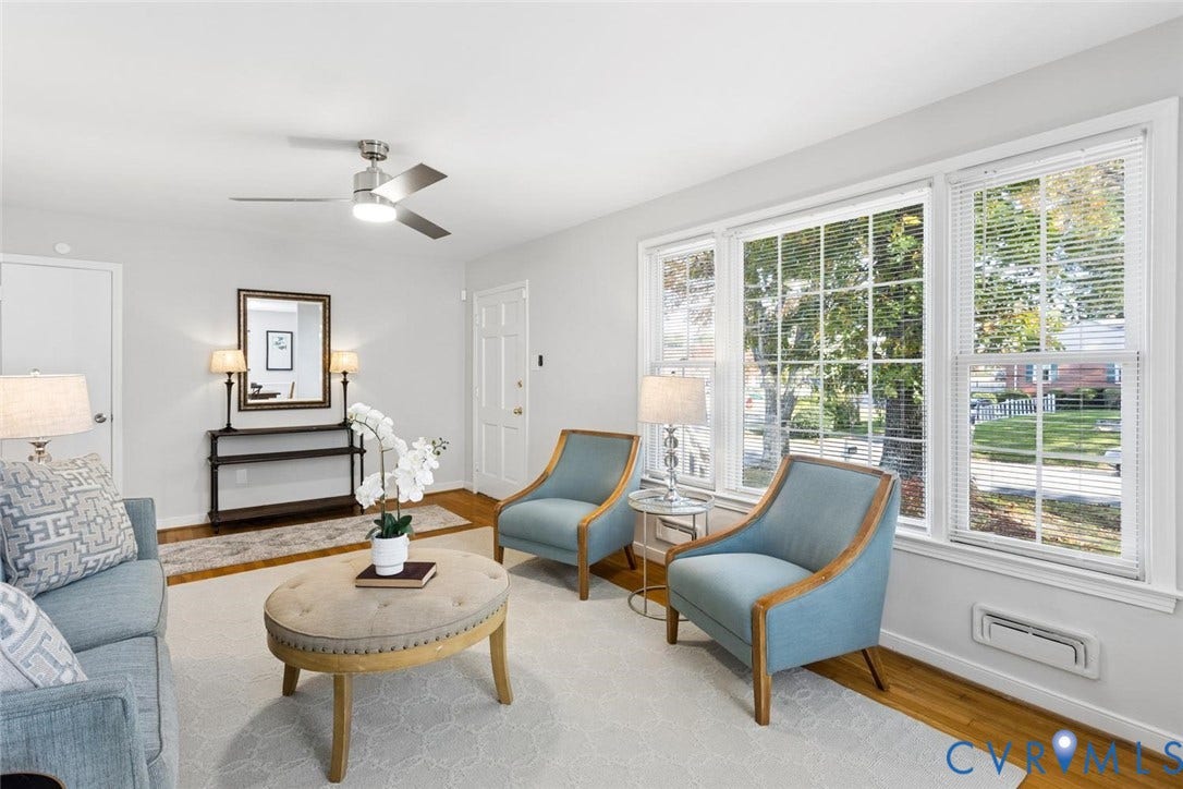 1014 Westbriar Drive, Henrico, VA 23238 Interior space featuring large multi-pane windows, wood-finish flooring, and a ceiling-mounted light fixture with fan