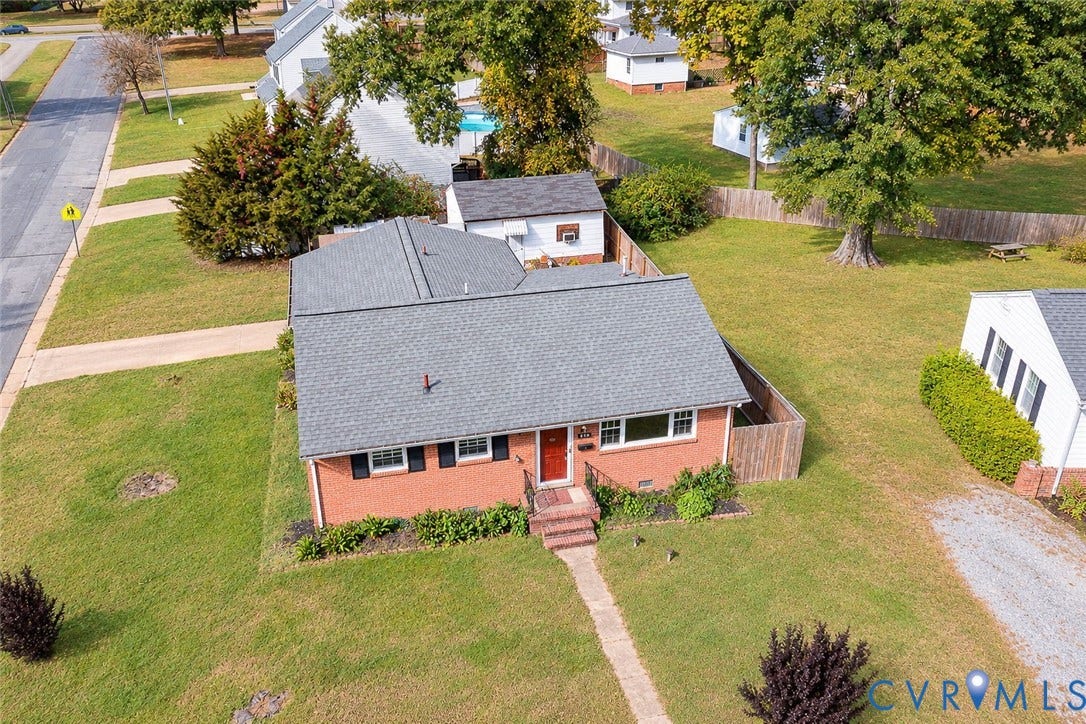 628 Ryan Avenue, Ryan, Colonial Heights, VA 23834 Brick exterior featuring a shingled roof, detached garage, and expansive lawn area