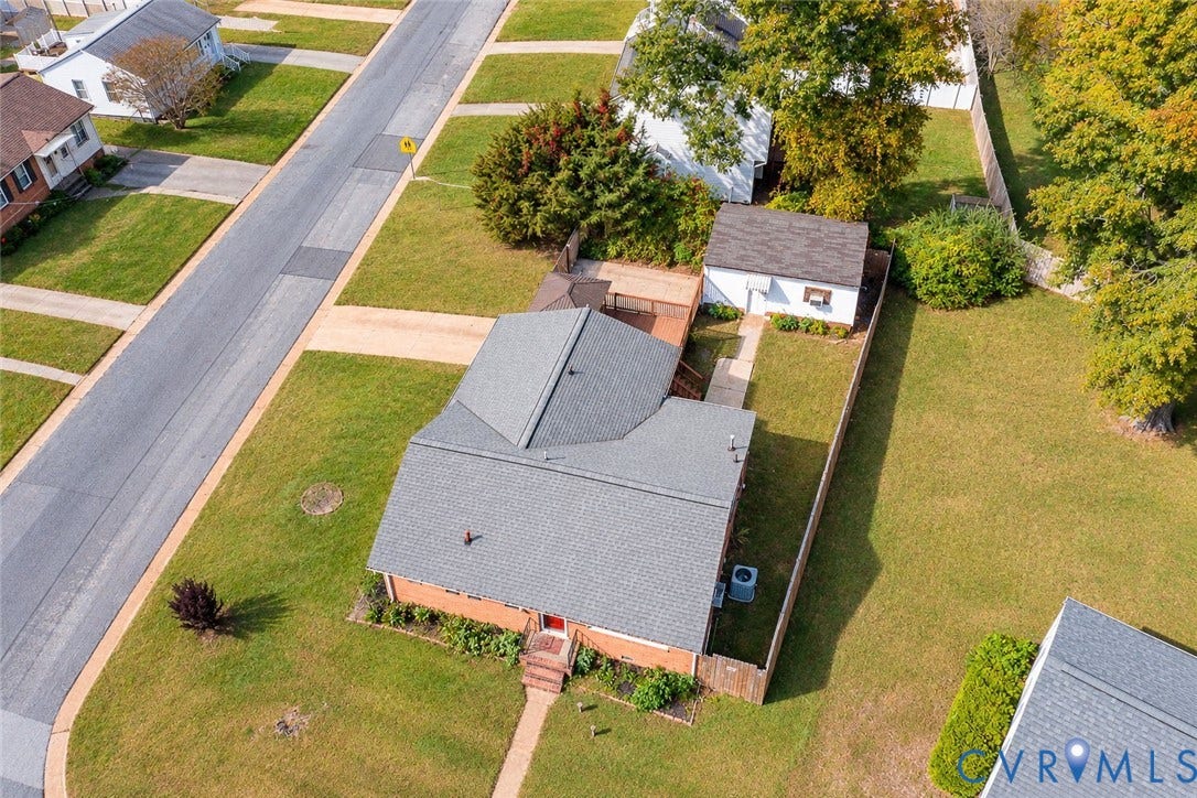 628 Ryan Avenue, Ryan, Colonial Heights, VA 23834 Aerial view of property featuring a brick exterior, shingled roof, detached garage, and fenced backyard with mature trees