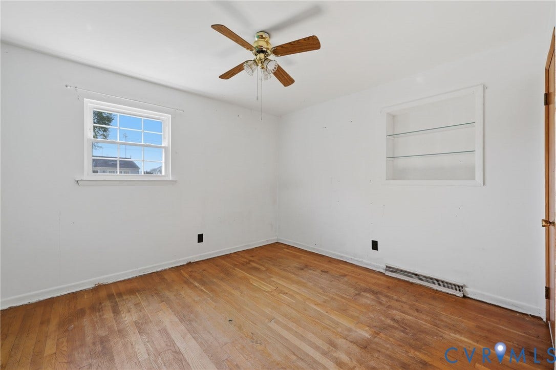 628 Ryan Avenue, Ryan, Colonial Heights, VA 23834 Wood-finish flooring, multi-pane window, built-in recessed shelving with glass inserts, and ceiling fan with integrated light fixture
