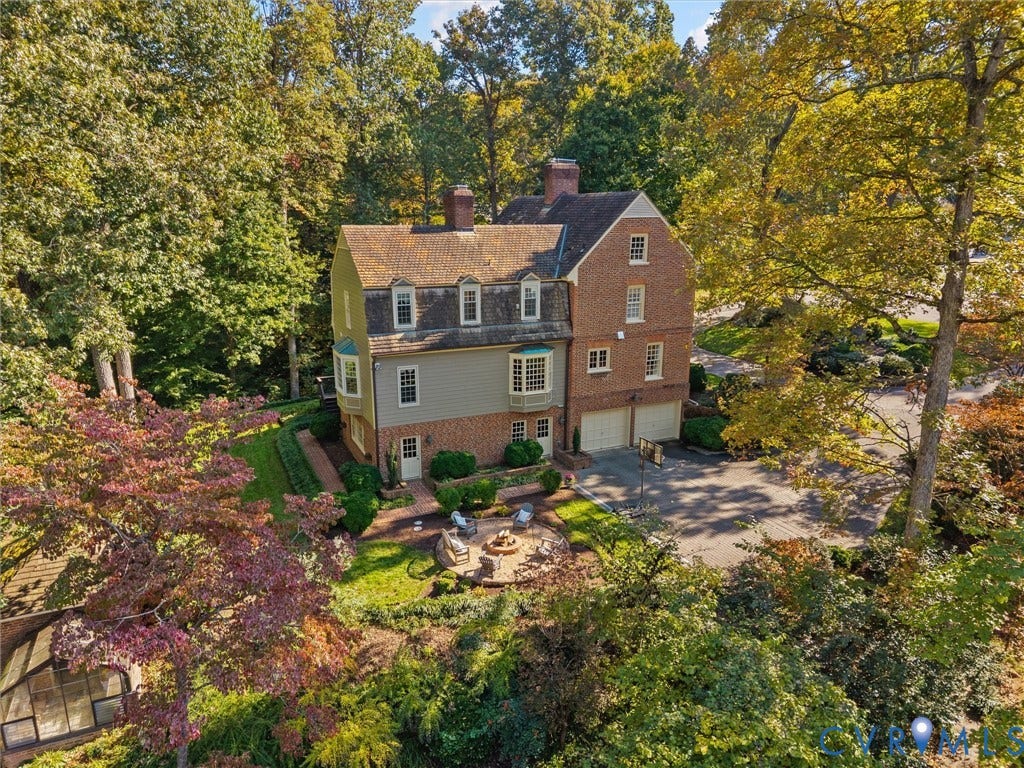 105 Running Cedar Lane, Countryside, Henrico, VA 23229 Multi-story residence featuring a brick and siding exterior, dual chimneys, multiple dormer windows, bay windows, and an attached two-car garage
