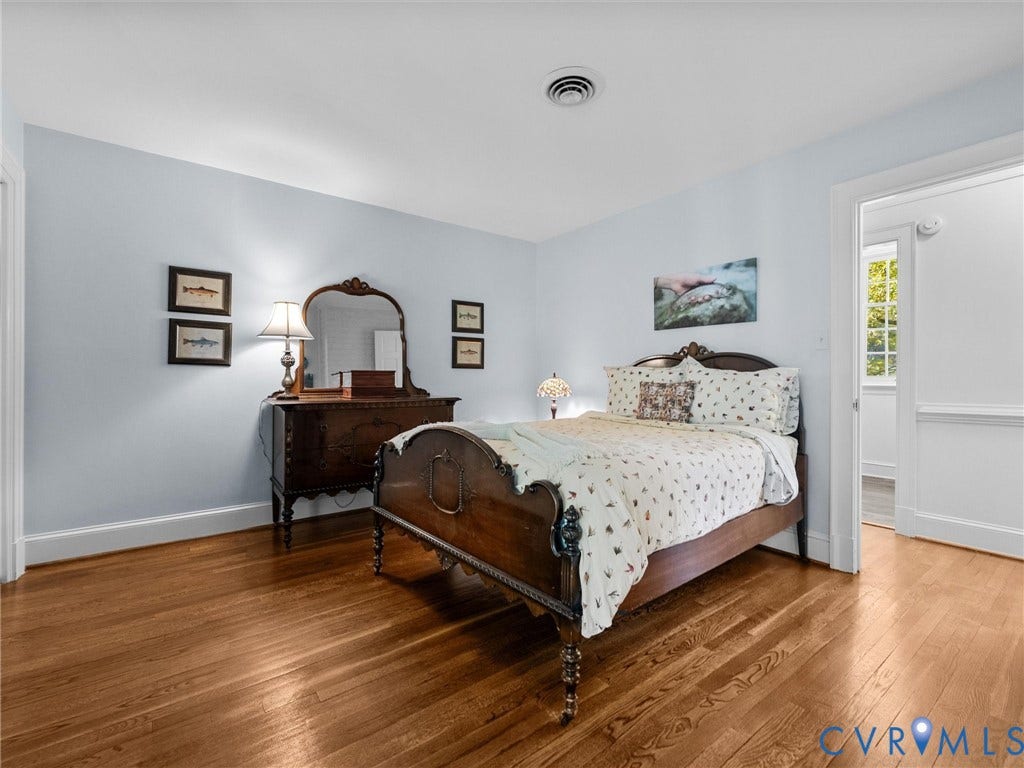 105 Running Cedar Lane, Countryside, Henrico, VA 23229 Room featuring wood-finish flooring, neutral wall coloring, and millwork chair rail molding