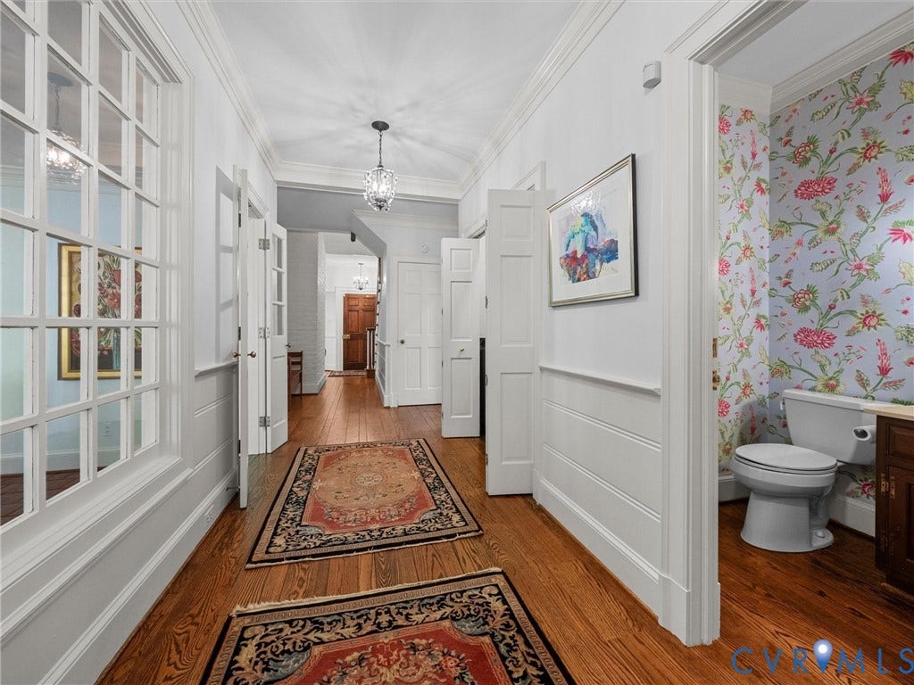 105 Running Cedar Lane, Countryside, Henrico, VA 23229 Hardwood flooring, crown molding, paneled wainscoting, glass-paned interior doors, and decorative wallpaper