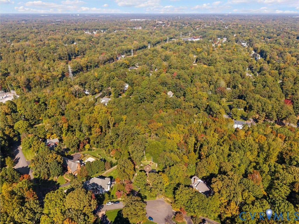 105 Running Cedar Lane, Countryside, Henrico, VA 23229 Aerial perspective featuring a sprawling wooded lot with established tree canopy and paved road access