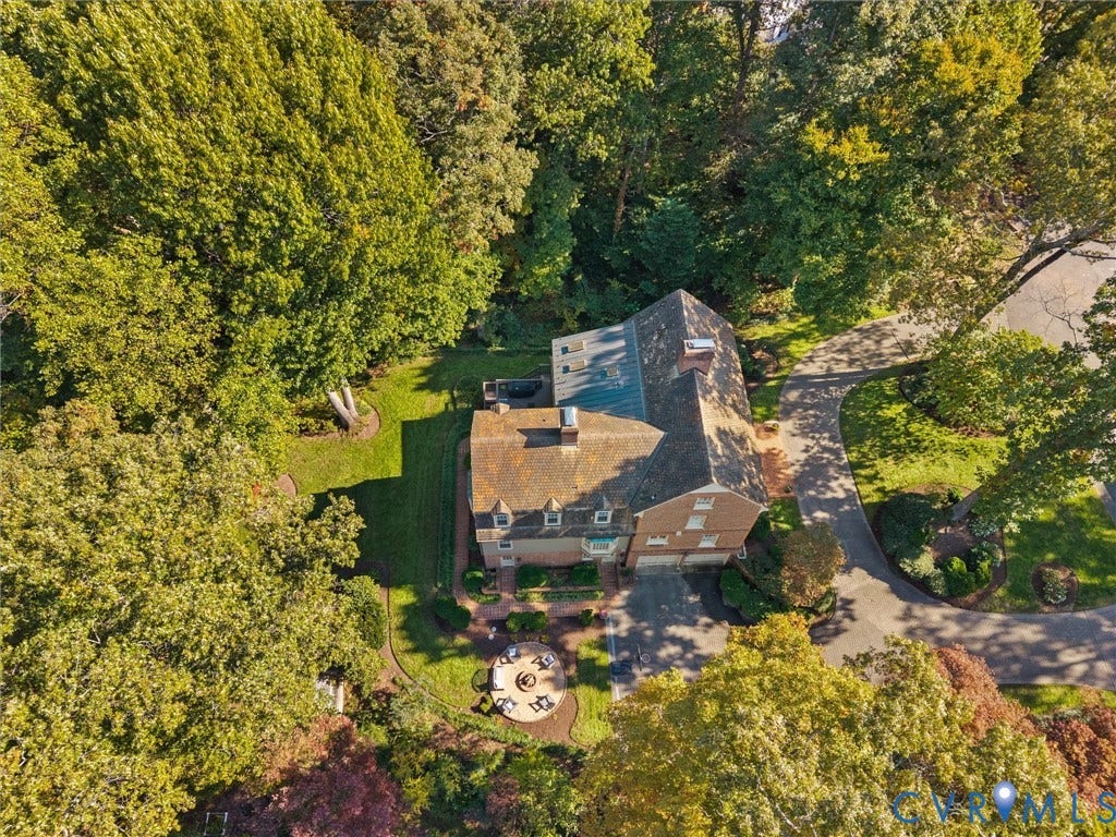 105 Running Cedar Lane, Countryside, Henrico, VA 23229 Aerial perspective of a multi-story residence featuring a brick exterior, shingled roof, paved driveway, brick hardscaping, and surrounding mature trees