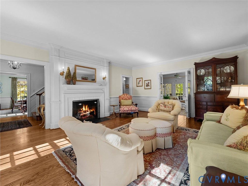 105 Running Cedar Lane, Countryside, Henrico, VA 23229 Living area featuring hardwood flooring, a fireplace with floor-to-ceiling millwork surround, crown molding, chair rail, and French doors