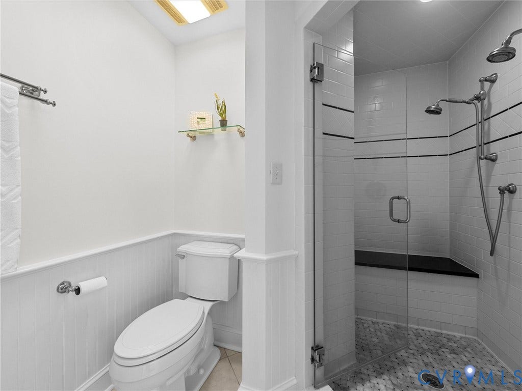 105 Running Cedar Lane, Countryside, Henrico, VA 23229 Walk-in shower with a glass door, built-in stone bench, and multi-setting shower head