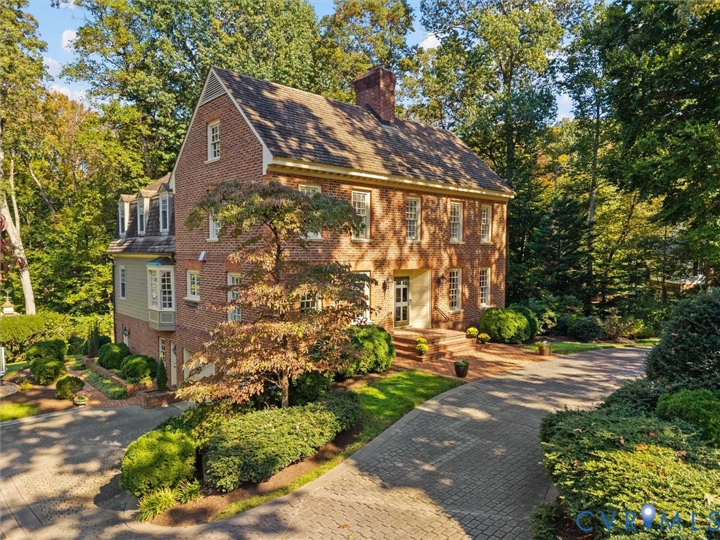 105 Running Cedar Lane, Countryside, Henrico, VA 23229 Traditional brick exterior featuring a multi-gable roofline, dormer windows, a decorative bay window, and a paved stone driveway