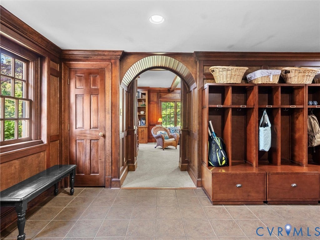 105 Running Cedar Lane, Countryside, Henrico, VA 23229 Custom wood-paneled walls, built-in wooden storage cubbies, arched architectural detail, multi-pane window, and tile flooring