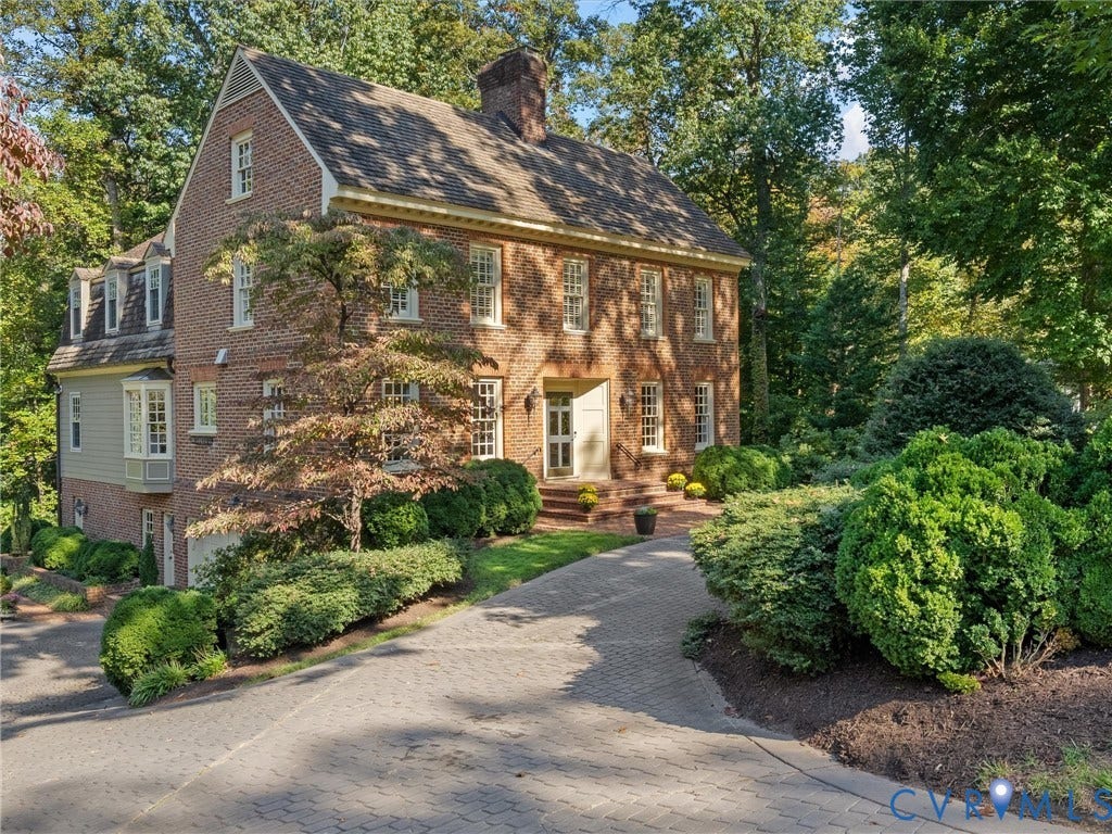 105 Running Cedar Lane, Countryside, Henrico, VA 23229 Classic brick exterior with a gable roof, decorative dentil molding, bay window, and a paved stone driveway
