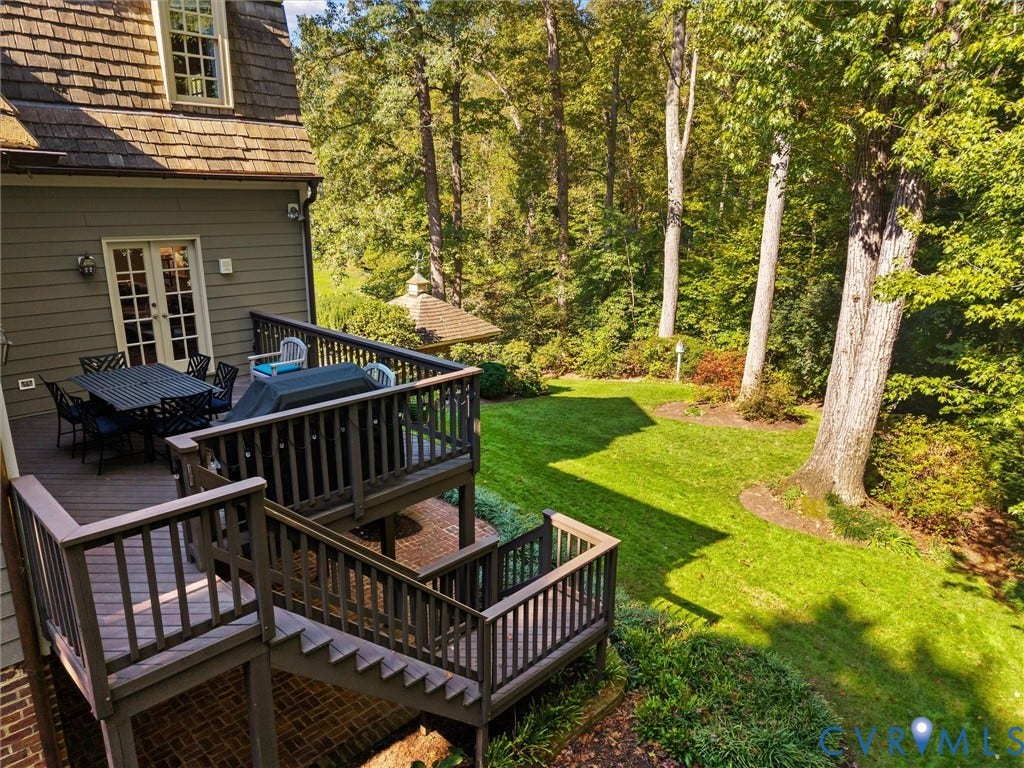 105 Running Cedar Lane, Countryside, Henrico, VA 23229 Multi-level wood deck with balustrades, brick patio, and expansive lawn featuring mature trees