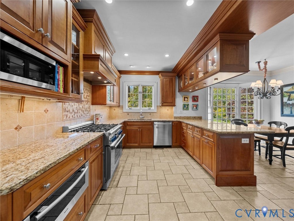 105 Running Cedar Lane, Countryside, Henrico, VA 23229 Kitchen featuring custom wood cabinetry, stone countertops, tiled flooring, stainless steel gas range, and recessed lighting
