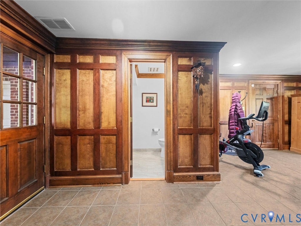 105 Running Cedar Lane, Countryside, Henrico, VA 23229 Custom wood wainscoting with integrated crown molding, solid wood paneled doors, and ceramic tile flooring