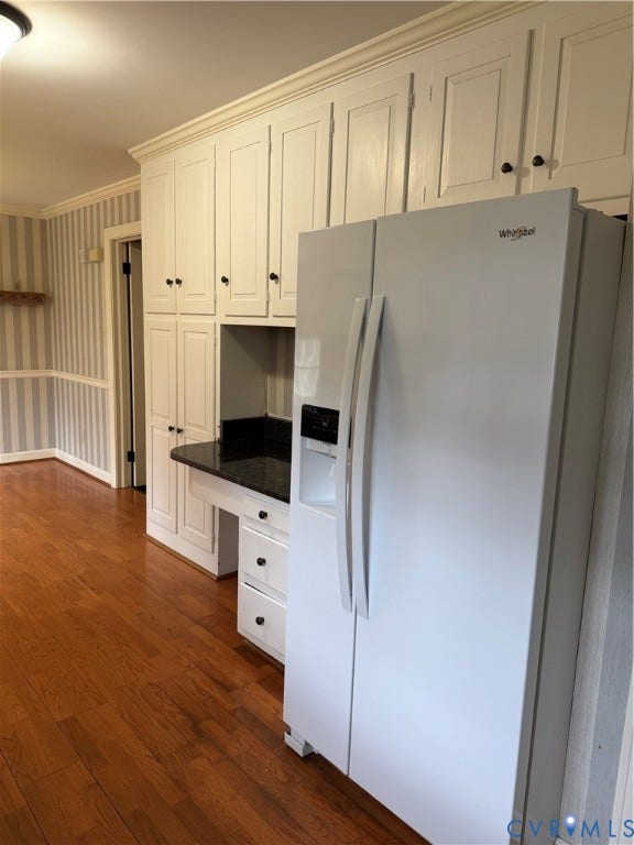 20 Jonquil Lane, Newport News, VA 23606 White cabinetry featuring floor-to-ceiling storage, dark solid-surface countertops, and wood-finish flooring