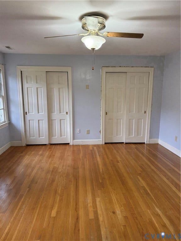 20 Jonquil Lane, Newport News, VA 23606 Wood-finish flooring, two sets of paneled closet doors, and a ceiling-mounted light fixture with a fan
