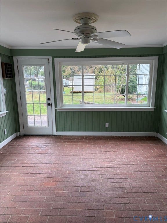 20 Jonquil Lane, Newport News, VA 23606 Enclosed area featuring red brick flooring, vertical paneled wall treatments, large-format picture window, white-finish ceiling fan, and glass-paneled exterior door