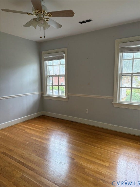 20 Jonquil Lane, Newport News, VA 23606 Wood-finish flooring, multi-pane windows with trim, chair rail molding, and ceiling fan with light fixture