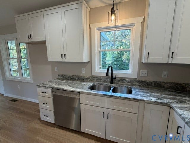 745 Gully Tavern Road, Detached, Rice, VA 23966 Kitchen featuring white shaker-style cabinetry, patterned stone-surface countertops, stainless steel undermount double-basin sink with matte black faucet, and wood-finish flooring