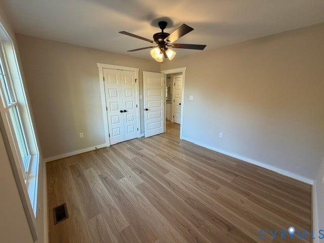 745 Gully Tavern Road, Detached, Rice, VA 23966 Room featuring wood-finish flooring, multi-pane window, ceiling fan with light fixture, and paneled doors
