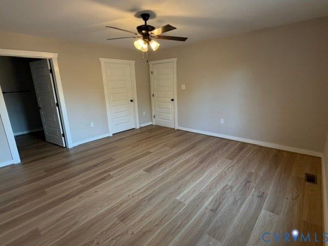 745 Gully Tavern Road, Detached, Rice, VA 23966 Neutral-toned interior featuring wood-finish flooring, a multi-light ceiling fan, and five-panel interior doors